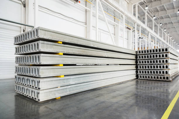 Stack of precast reinforced concrete slabs in a house-building factory workshop