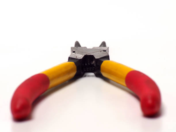 Picture of snap ring plier that has a yellow - red handle Picture of snap ring plier that has a yellow - red handle. Shoot on white isolated background. orbis stock pictures, royalty-free photos & images