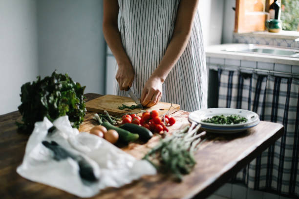 istock Female chef prepares healthy, mediterranean meal 1320719683