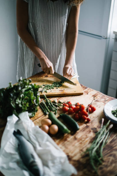 istock Female chef prepares healthy, mediterranean meal 1320719692