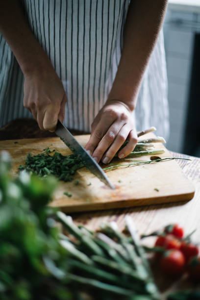 istock Female chef prepares healthy meal 1320719695
