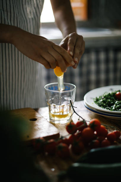 istock Female chef prepares eggs for a healthy meal 1320719700