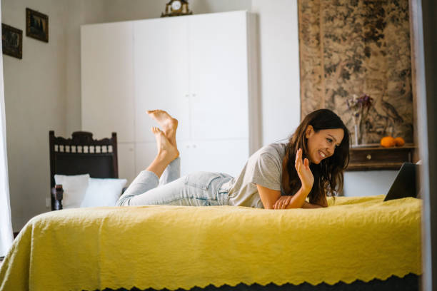 istock Young woman hosts video conference from home 1320721254