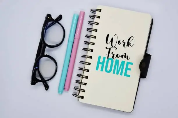 Photo of 'Work from home' word on the notebook.