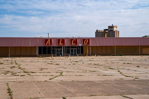 Tucamcari, New Mexico - May 7, 2021: Abandoned Alco store, a chain retail hardware and discount store, sits decaying, since the stores closed in 2015