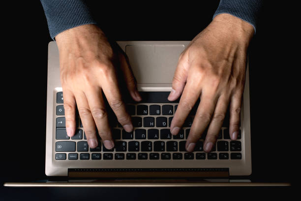 istock Close up of person hand typing on laptop keyboard, author useing internet on notebook computer 1320726376