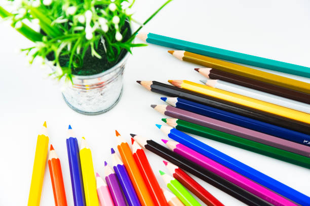 istock Coloured Pencils on White Paper Background 1320728069