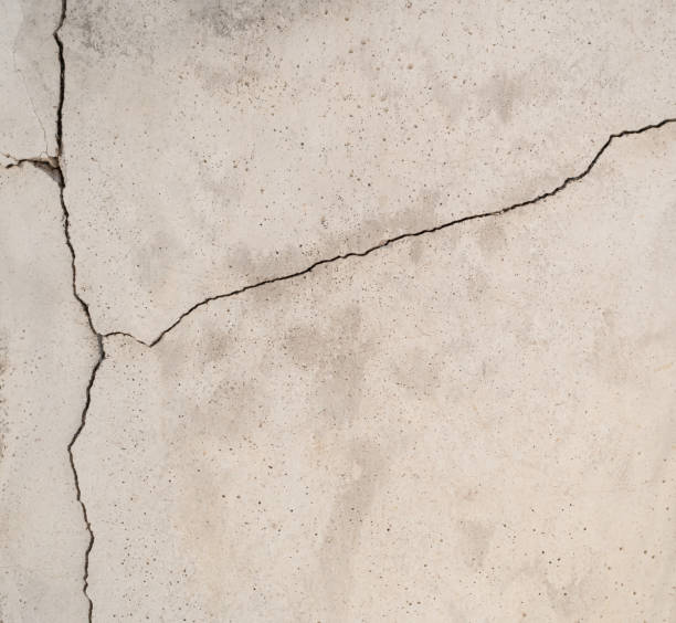 istock Crack cement texture of a broken wall background 1320733077