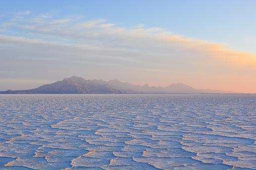 Salt flats and a mountain in the sunrise