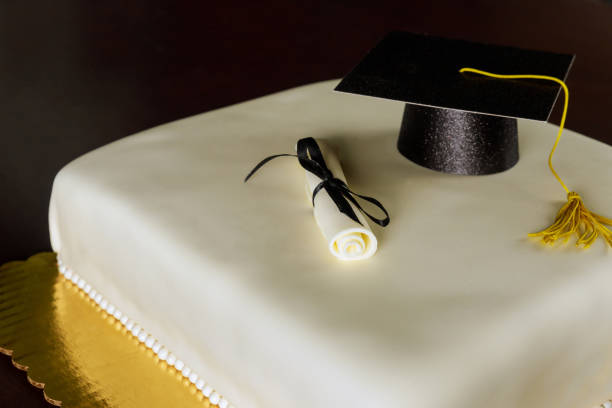 istock Graduation fondant cake with hat and diploma decoration. 1320735392