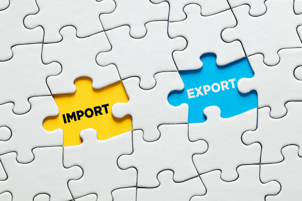 istock Missing puzzle pieces with the words import and export. Import and export balance or equilibrium in economy 1320740614