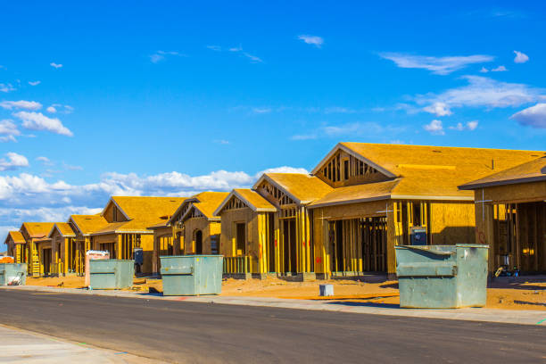 istock Row Of New Homes Under Construction In Housing Development 1320742090