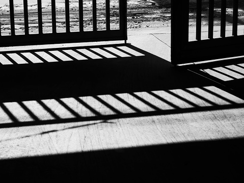 Old steel door that open to the outside monochrome or black and white image Door that opens to Freedom to detainees