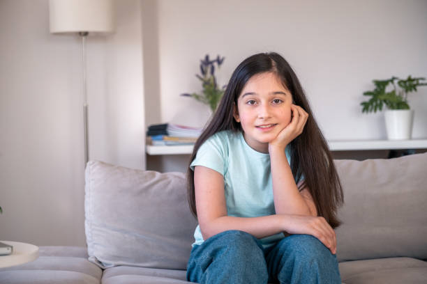 istock teenage girl looking at camera 1320746074