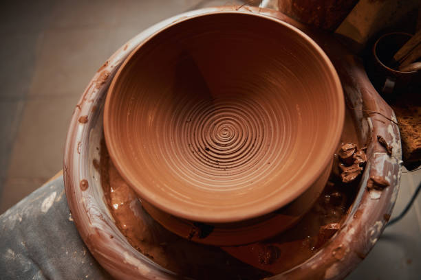 istock Image of fresh clay bowl on pottery wheel in art studio 1320746198