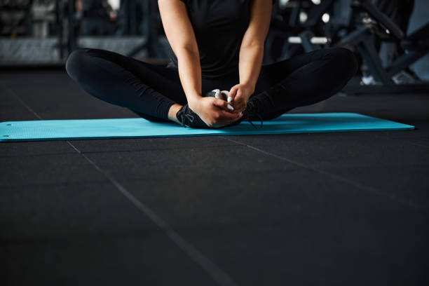 istock Female doing stretching after training in gym 1320749470