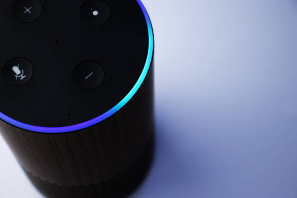 istock Close up of smart speaker assistant - personal assistant - blue light 1320750119