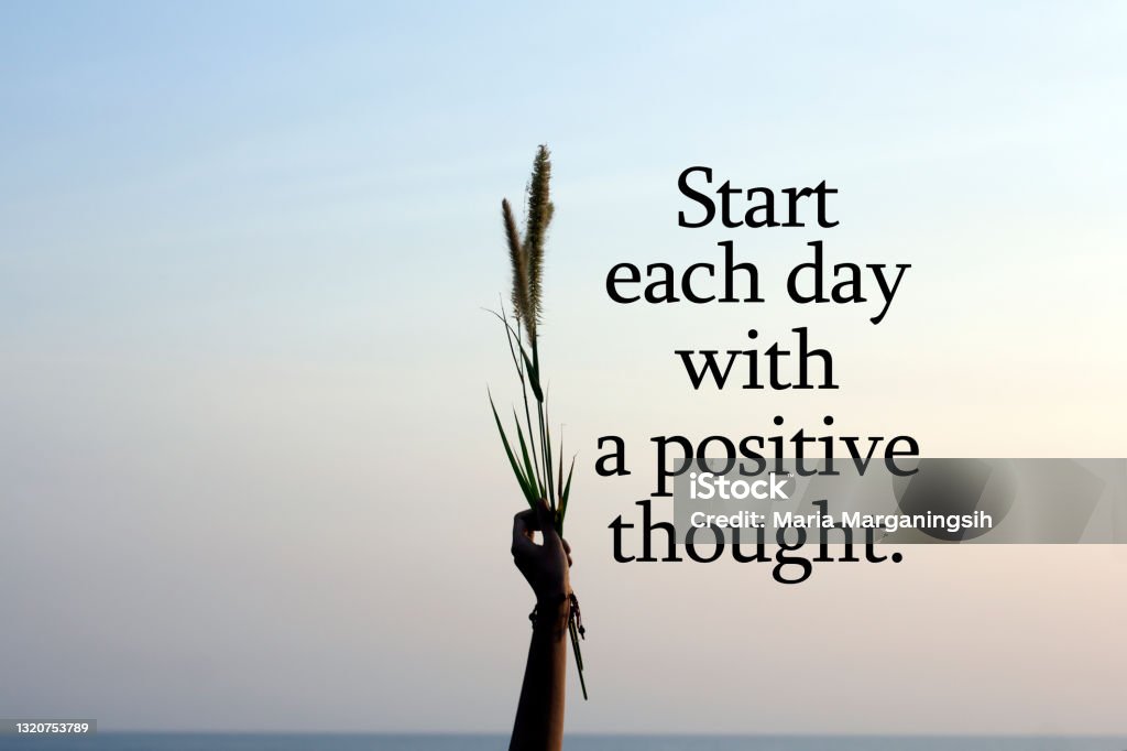 Start Each Day With A Positie Thought With Person Holding Flower Plant In  Hand On Blue Sky Background Stock Photo - Download Image Now - iStock