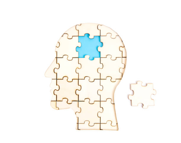 istock Human head jigsaw puzzle with the final missing piece isolated on white 1320756014