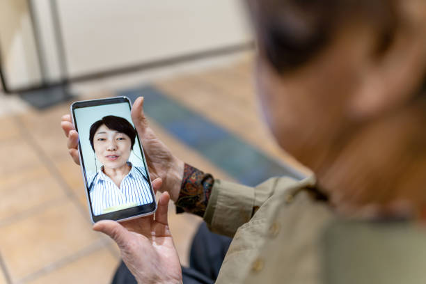 istock Asian senior watching smart phone. 1320756035