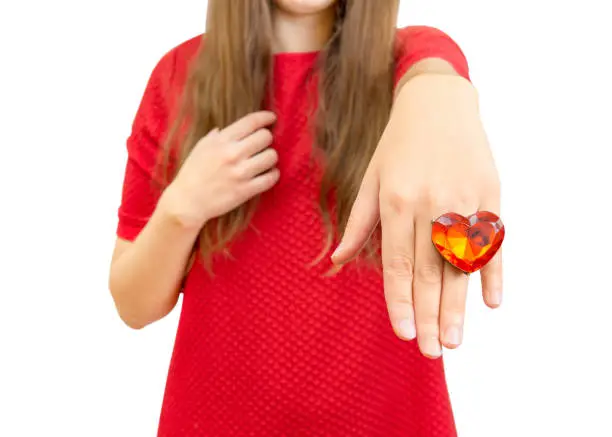Photo of Lady in red with a huge fine jewelry heart shaped ring