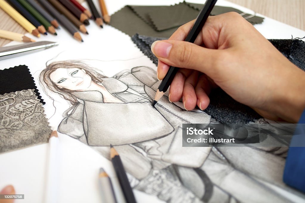 fashion designer Fashion designer is drawing an artistic fashion sketch ,close-up photo Adult Stock Photo