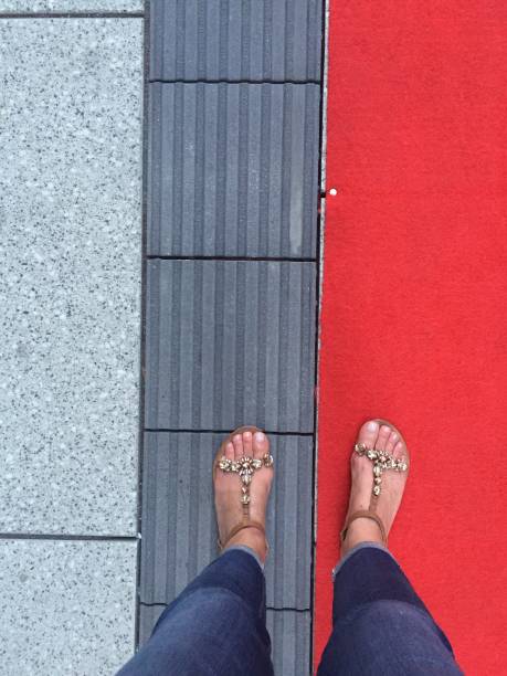 istock Low Section Of Woman Standing On Tiled Floor 1320758136