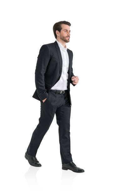 istock Young businessman is walking, hand in pocket, isolated over white background 1320762726