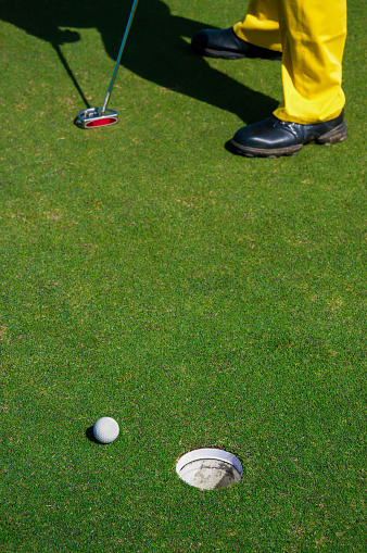 Golfer playing golf in field