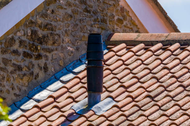 istock Wood burning chimney stack on a terracotta slate room 1320763661