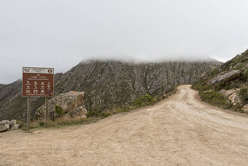 Oudtshoorn, South Africa - April 5, 2021: Information board on the historic Swartberg Pass near Oudthoorn in the Western Cape Karoo