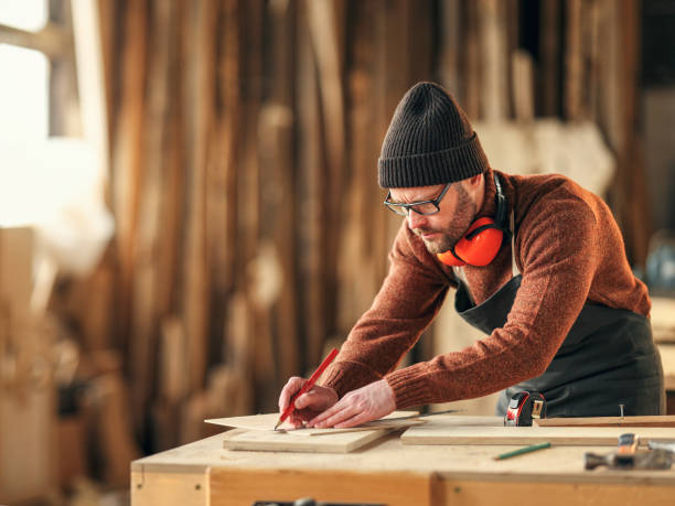istock Joiner making marks on wooden detail 1320765936