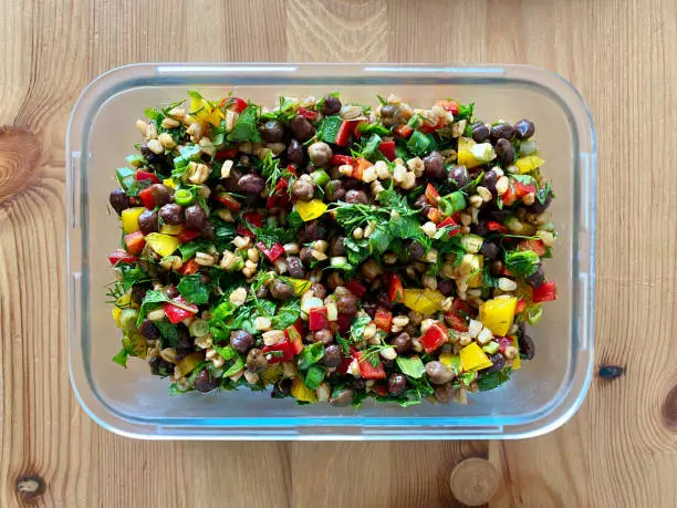 Homemade Black Chickpea and Wheat Salad on Wooden Table. Murgia (cece nero). Ready to Eat.