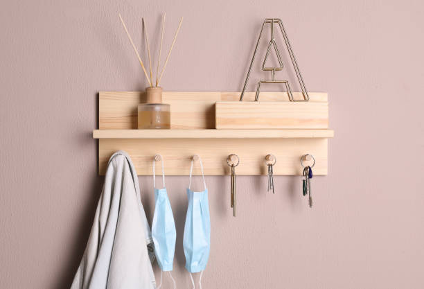 istock Wooden hanger for keys on color wall 1320767096