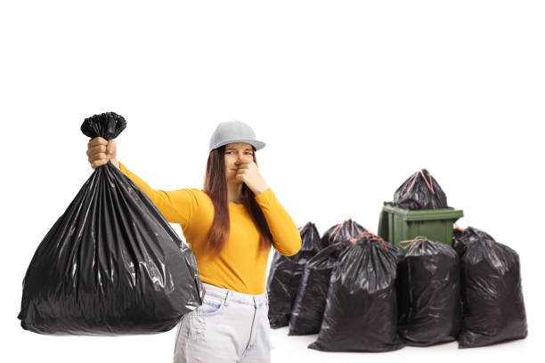 https://media.istockphoto.com/id/1320767216/photo/young-female-holding-a-smelly-bin-bag-in-front-of-a-bin-and-a-pile-of-black-bags.jpg?s=612x612&w=0&k=20&c=-7fqFeLyFgG8R1Ew-FB8pMrlPa3yY8Et67HCuPrIwRQ=