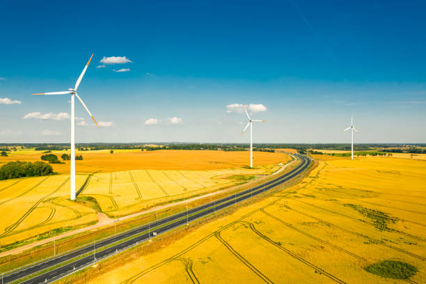 istock Fields, highway and wind turbines. Alternative energy in Poland. 1320768165