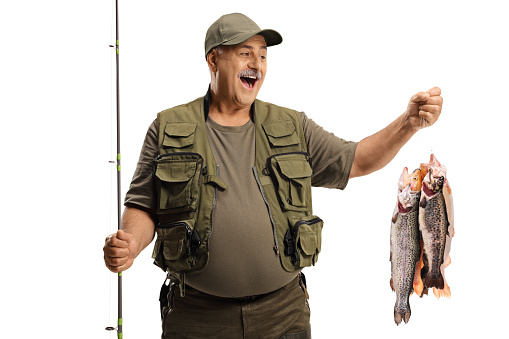 Happy fisherman holding many fish on a hook isolated on white background