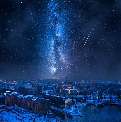 Milky way over Opera in Bydgoszcz in winter, Poland. Bydgoszcz at night in winter.