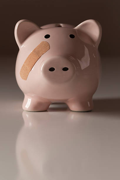 istock Piggy Bank with Bandage on Face 132076978