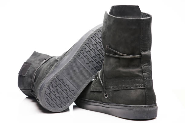 istock Black leather boots with shoelaces 1320771334