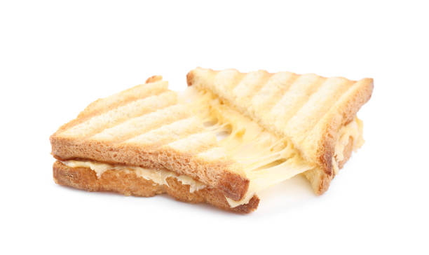 istock Fresh tasty cheese sandwich cut in half on white background 1320774284