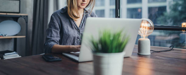 istock Woman working on laptop. Freelancer at remote work. Female student learning on-line via computer. Blogger or journalist writing new article. 1320775589