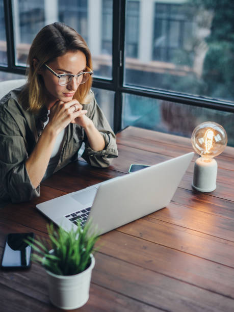 istock Woman working on laptop. Freelancer at remote work. Female student learning on-line via computer. Blogger or journalist writing new article. 1320775601