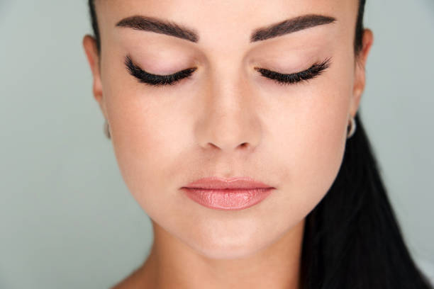istock Beautiful girl with extended eyelashes and eyes closed 1320776544