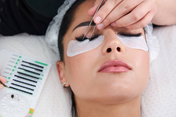 istock Eyelash Extension Procedure. Woman Eye with Long Eyelashes 1320776648