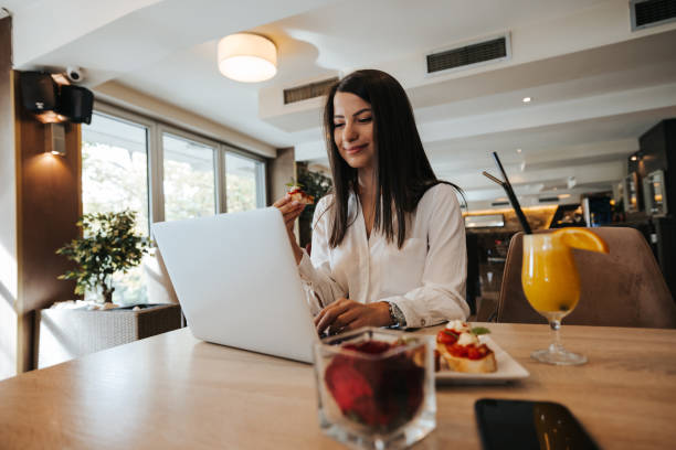 istock Business woman having working breakfast in restaurant 1320776736