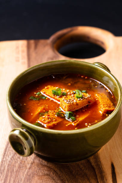 Food concept Korean spicy tofu soup on wooden board with copy space