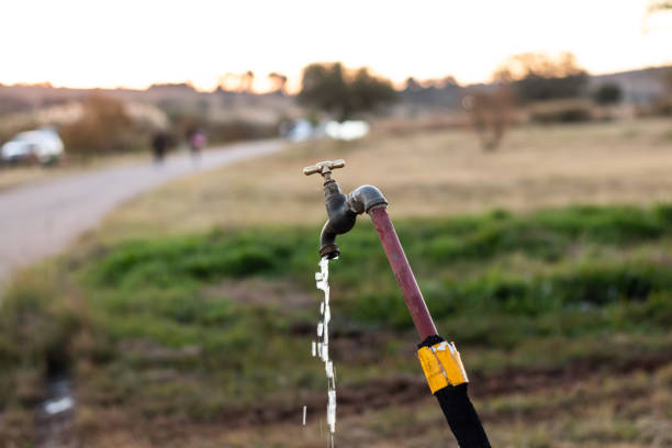 Open water tap outisde in nature. Water tap open flowing of water.