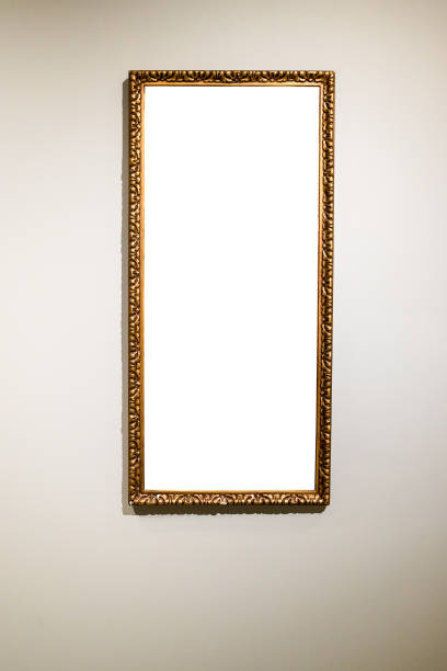 istock narrow tall picture frame on gray brown wall 1320778152
