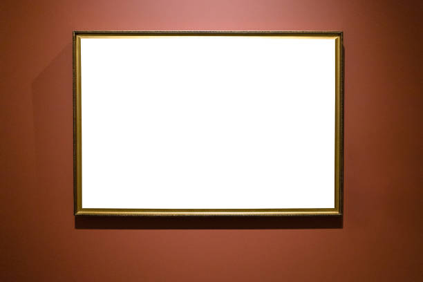 istock narrow bronze picture frame on brown wall 1320778158